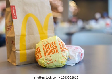 Download Thailandapril2019 Cheeseburger Yellow Paper Wrap Take Stock Photo Edit Now 1383582815 PSD Mockup Templates