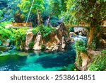 Tham Chang Jang cave with water source and river in Vang Vieng Vientiane Province Laos in Southeastasia Asia.