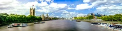 Thames River Panorama And London Eye With Westminster Palace In London.
