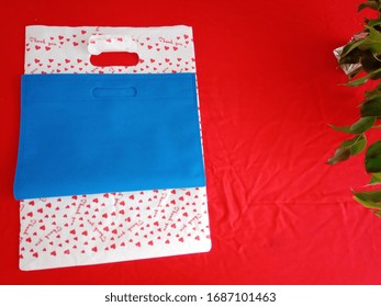 Thank You Bag With Blue Non Woven Shopping Bags On Red Background, Polypropylene Fabric Bag