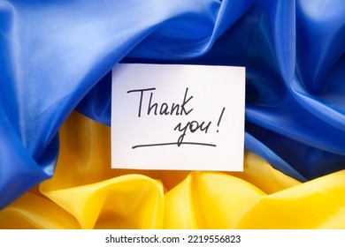 Thank you - card with lettering on yellow blue colors ukrainian flag, war in Ukraine concept - Powered by Shutterstock