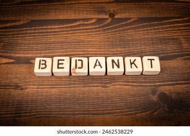 Thank you in Dutch. Alphabet blocks on wood texture background. - Powered by Shutterstock