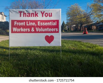 Thank You Front Line, Essential Workers & Volunteers Sign In Front Of A House During Corona Virus Pandemic Outbreak Quarantine. Emergency Workers, First Responders, Health Care Workers Appreciation.
