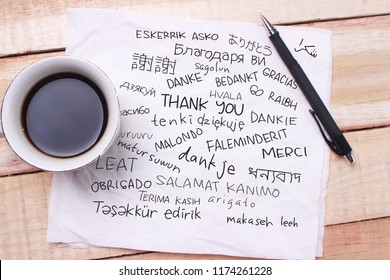 Thank You Gratitude Words Letter In Many Languages, Written On Notepad, Work Desk Top View. Motivational Business Typography Quotes Concept 