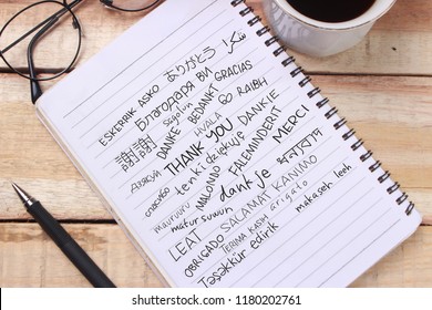 Thank You Gratitude Words Letter In Many Languages, Written On Notepad, Work Desk Top View. Motivational Business Typography Quotes Concept 