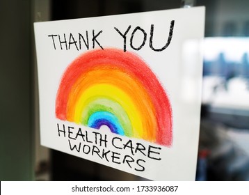 THANK YOU Healthcare Workers Child's Painting Hanging At Window As Appreciation Support Message For Doctors And Nurses Fighting COVID-19 At Hospitals.