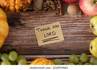 Thank You LORD, A Handwritten Note On An Autumn Wooden Background With Various Fall Fruits. Top Table View, A Closeup. Christian Thanksgiving, Giving Thanks To God, Biblical Concept.