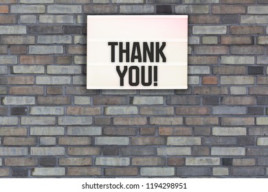 Thank You Message In Light Box On Brick Wall Background For Marketing Message