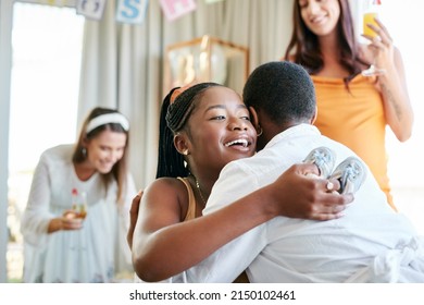 Thank you so much for coming. Shot of a young mother to be hugging her friend for a gift given at her baby shower. - Powered by Shutterstock