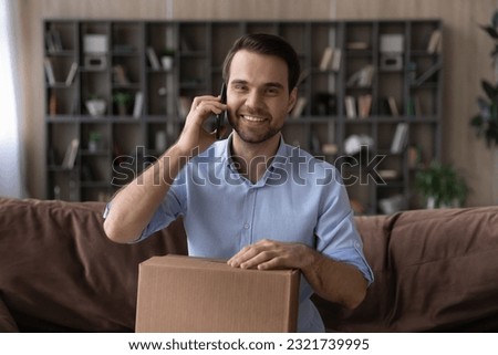 Thank you for perfect service. Grateful male courier company customer get cargo box answer client support questions confirm fast safe shipping. Portrait of happy young man make phone call hold package