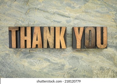 Thank You - A Phrase In Vintage Letterpress Wood Type On A Green Slate Rock Background