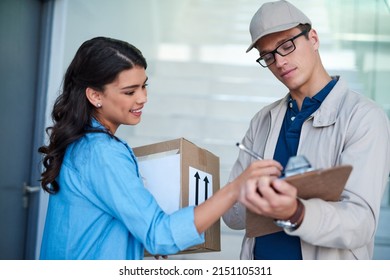 Thank You For Such A Swift Service. Shot Of A Young Woman Signing For A Delivery From The Courier.