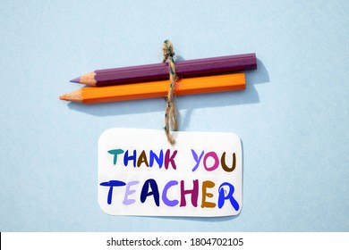 Thank You Teacher Written On Paper Note With Color Pencils, Happy Teacher's Day Conceptual Photo