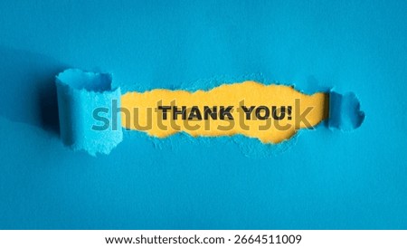 Thank you, typescript text message on top of yellow paper with torn blue paper on top.