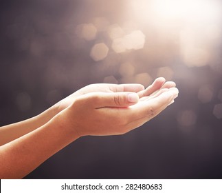 Thanks Giving concept: Mercy person open empty two hands and palm up for pray and worship to God on blur background