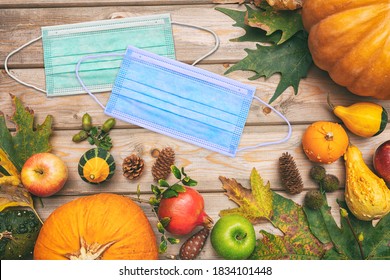 Thanksgiving 2020, Coronavirus Days, COVID 19 Protective Face Mask And Thanksgiving Flatlay On Wooden Background. Corona Virus Spread Prevention Measure, Top View