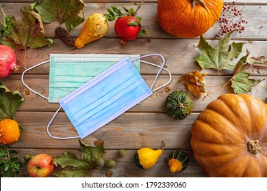 Thanksgiving 2020, Coronavirus Days, Protective Face Mask And Thanksgiving Flatlay On Wooden Background. COVID 19 Spread Prevention Measure