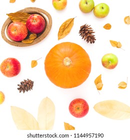 Thanksgiving autumn background made of fall dried leaves, pine cones, apples and pumpkin on white background. Flat lay, top view