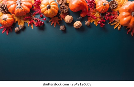 Thanksgiving and Autumn decoration concept made from autumn leaves and pumpkin on dark background. Flat lay, top view with copy space. - Shutterstock ID 2342126003