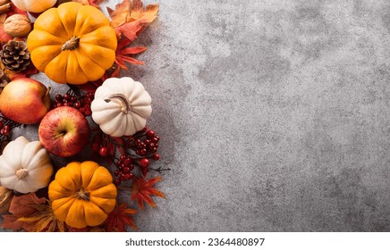Thanksgiving and Autumn decoration concept made from autumn leaves and pumpkin on stone background. Flat lay, top view with copy space. - Shutterstock ID 2364480897