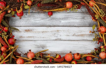 Thanksgiving autumn decorations in rectangle border on white rustic wood 