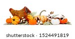Thanksgiving cornucopia filled with autumn vegetables, pumpkins and fall decor isolated on a white background