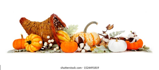 Thanksgiving cornucopia filled with autumn vegetables, pumpkins and fall decor isolated on a white background - Shutterstock ID 1524491819