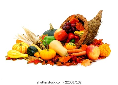 Thanksgiving cornucopia filled with fresh harvest vegetables - Shutterstock ID 220387132