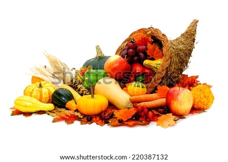Thanksgiving cornucopia filled with fresh harvest vegetables