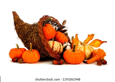 Thanksgiving cornucopia filled with pumpkins isolated on a white background - Shutterstock ID 1191061948