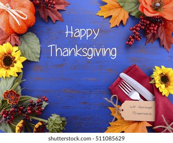 Thanksgiving Dark Blue Wood Background With Decorated Borders Of Sunflowers And Place Settings, And Happy Thanksgiving Text.