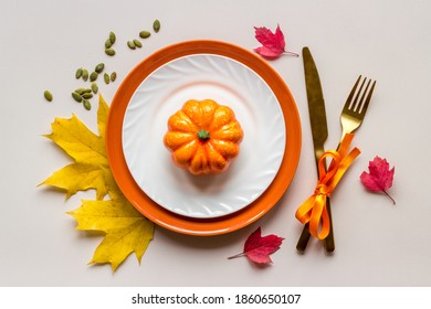 Thanksgiving Day Dinner Table, Top View . Autumn Vegetables On Plate With Cutlery