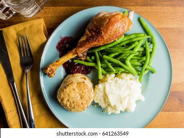 Thanksgiving Dinner Meal With Turkey Leg Mashed Potatoes Green Beans And Homemade Biscuit 