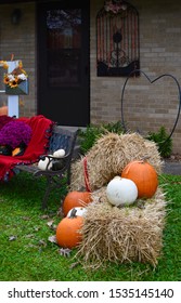 Thanksgiving Fall Harvest Outdoor Decorating Straw Hay Bales Pumpkins Acorns Gourds Mums Leaves Sunflowers Antique Window Pine Cones Needles Steel Milk Vase Window Box Bench Blanket Ribbon Beautiful