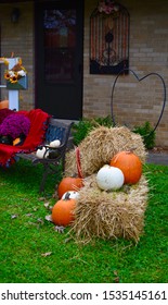 Thanksgiving Fall Harvest Outdoor Decorating Straw Hay Bales Pumpkins Acorns Gourds Mums Leaves Sunflowers Antique Window Pine Cones Needles Steel Milk Vase Window Box Bench Blanket Ribbon Beautiful