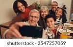 Thanksgiving, food and selfie of family in home for lunch, supper and Christmas dinner together. Happy, picture and grandparents, parents and kid with memory for festive event, holiday or celebration