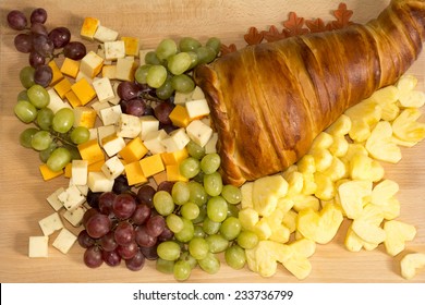 Thanksgiving Fruits and Cheeses Cornucopia  Bread on Wooden Board - Powered by Shutterstock