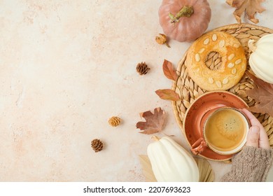 Thanksgiving Holiday  Background With Coffee Cup, Cookie, White Pumpkin And Woman's Hand N Warm Sweater. Top View, Flat Lay