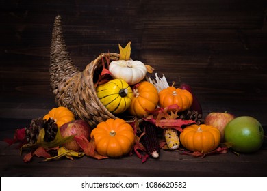 A Thanksgiving Holiday Decorative Cornucopia With Pumpkins, Squash, Leaves Etc