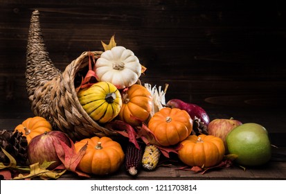 A Thanksgiving Holiday Decorative Cornucopia With Pumpkins, Squash, Leaves Etc