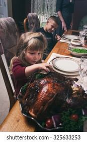 Thanksgiving: Little Girl Takes A Taste Of Turkey