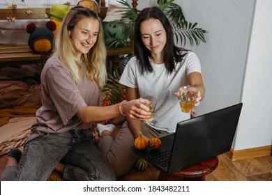 Thanksgiving Online, Virtual Thanksgiving Dinner, Celebrate Family And Show Gratitude In New Normal. Online Meeting With Family And Friends In Covid Pandemic Time. Two Young Women Near Laptop