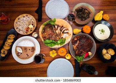 Thanksgiving Spread With Turkey,  Ham, Pie, And Wine 