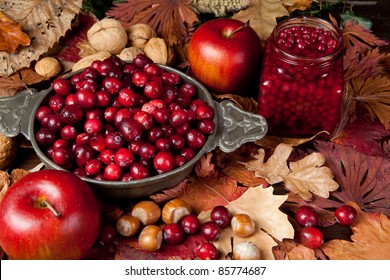 Thanksgiving Still-life With Cranberries, Autumn Leaves, Apples And Nuts