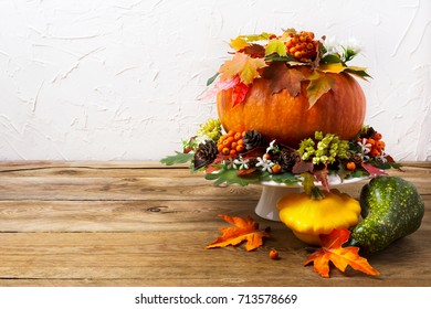 Thanksgiving Table Centerpiece With Pumpkin, Colorful Leaves And Yellow Squash, Copy Space. Fall Greeting Background. 