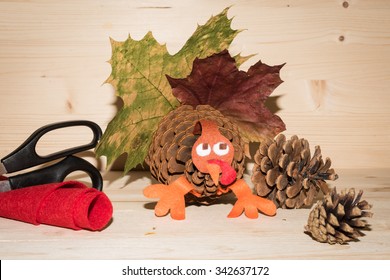 Thanksgiving Turkey Made Of Pine Cone And Autumn Leaves. Holiday Crafts Decoration