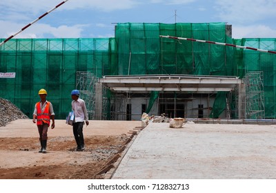 THANLYN/MYANMAR - August 20, 2015: Workers at Thilawa Special Economic Zone during construction 