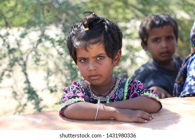 Tharparkar Sindh, Pakistan - March, 2019: Poor Village Girl Boys Children Smiling Shying Face Closeup In Traditional Dress Thar Desert And Rajhastan India, Hinduism In Pakistan Hindu Religion People