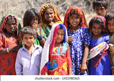 Tharparkar Sindh, Pakistan - March, 2019: Poor Village Girl Boys Children Smiling Shying Face Closeup In Traditional Dress Thar Desert And Rajhastan India, Hinduism In Pakistan Hindu Religion People