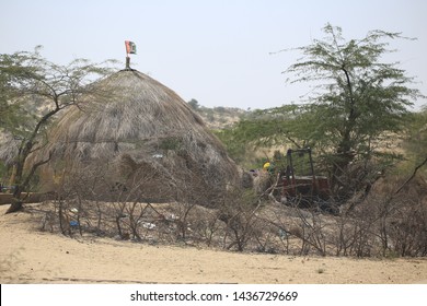 Tharparkar Sindh, Pakistan - March, 2019:  Village Huts In Thar Desert Old Poor Houses Animals In Rajhastan India, Hinduism In Pakistan Hindu Religion People